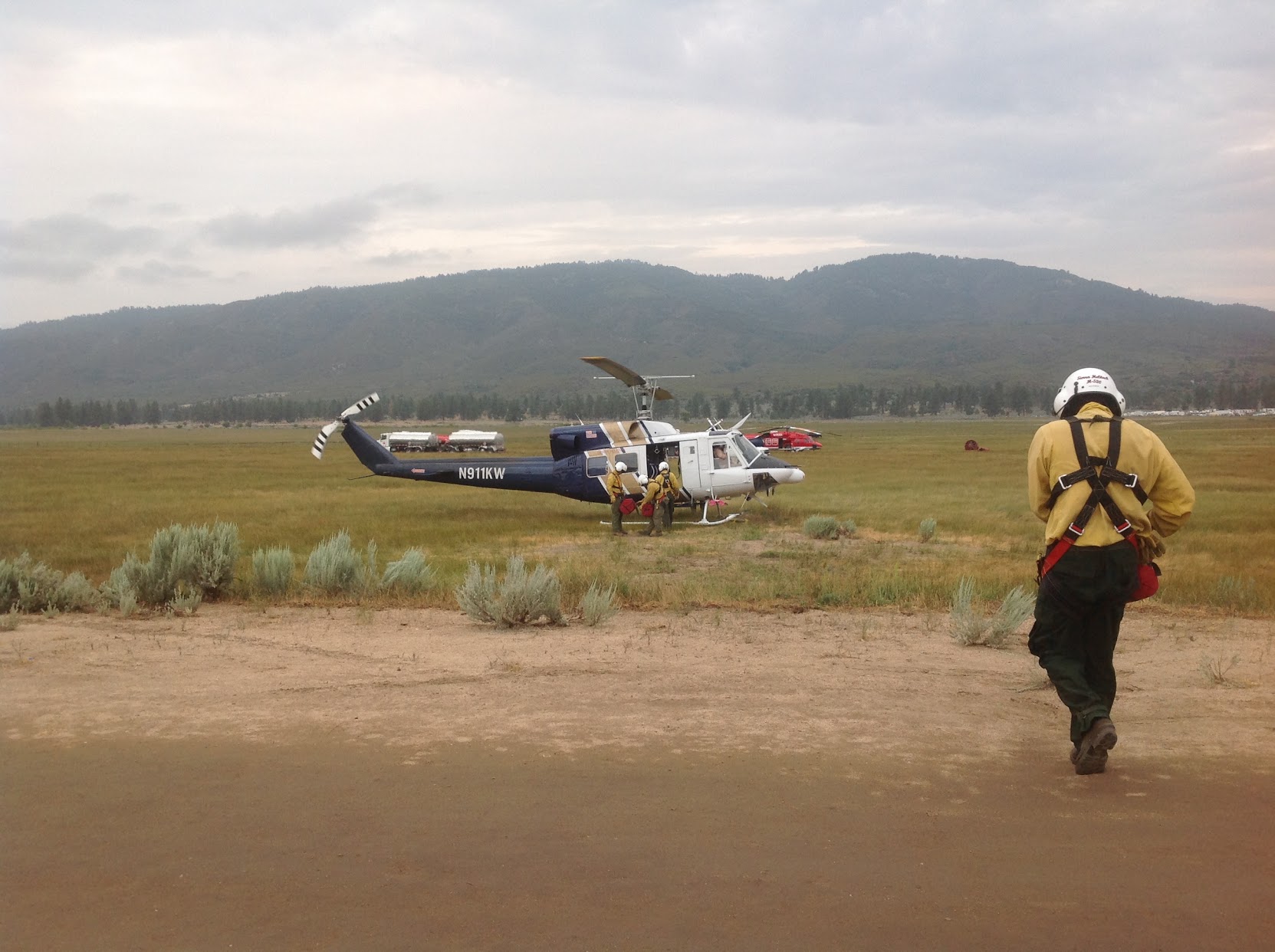 Firefighters loading onto a helicopter