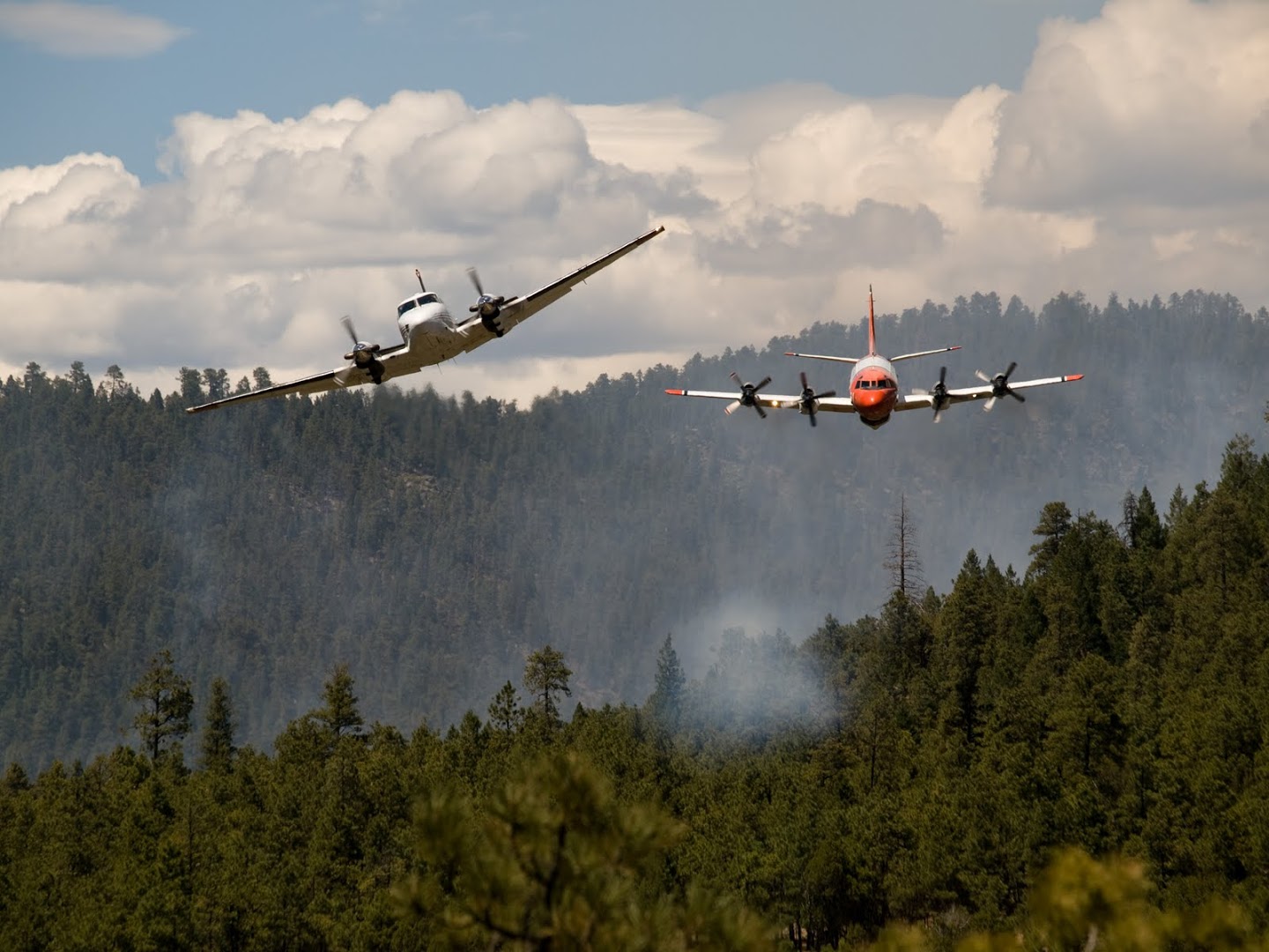 2 firefighting aircraft in flight